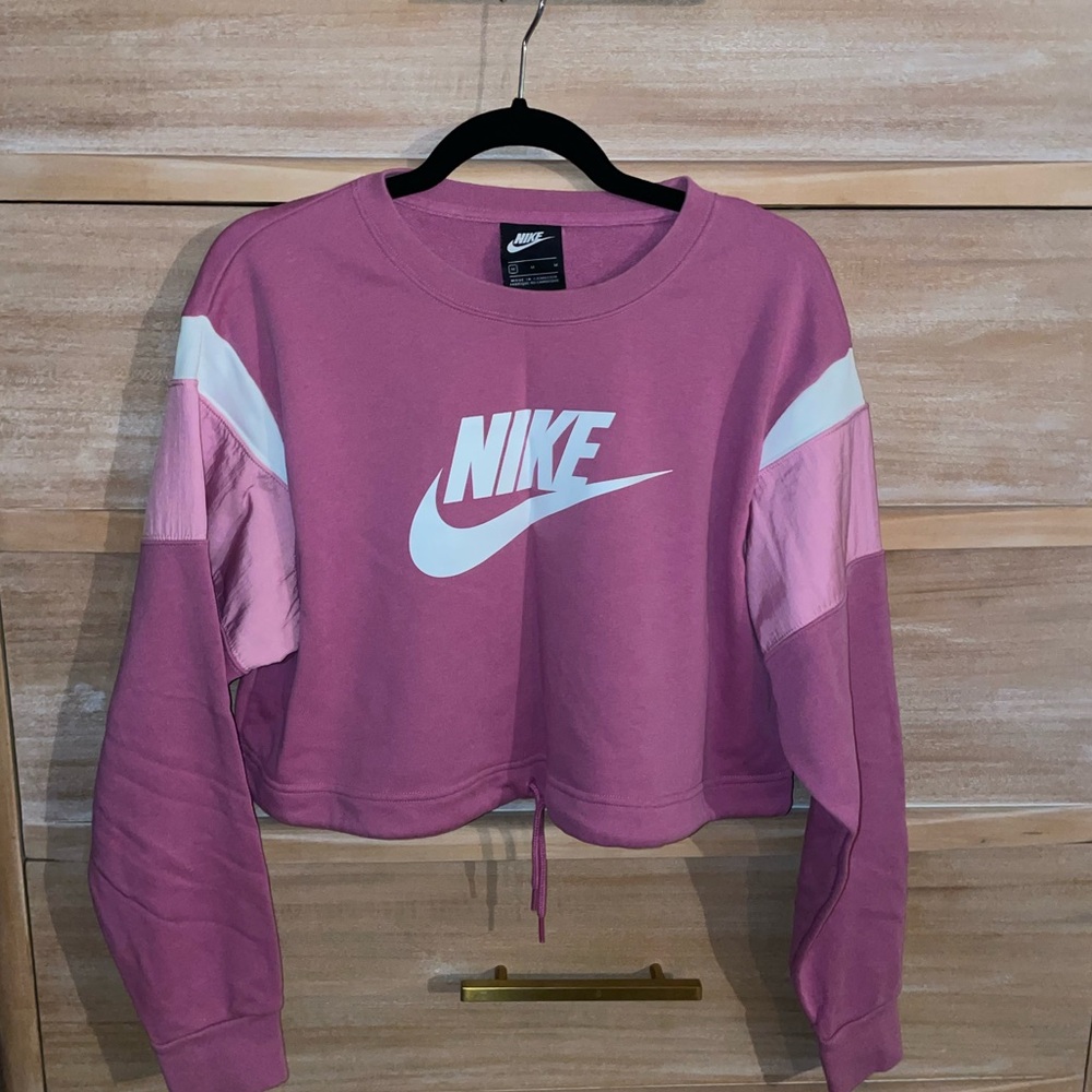 Nike women’s cropped sweatshirt. Size medium. Pink with drawstring waist.